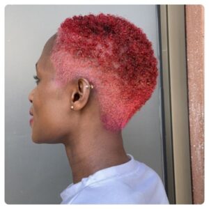 Woman with balayage hair color at Afro Couture Natural Hair Salon in Uganda